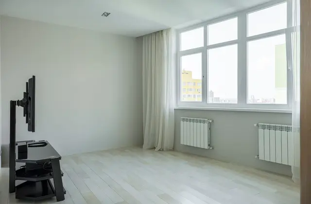 Radiateur à inertie électrique dans un salon — aides CEE 2026